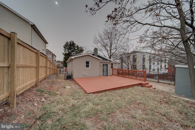 view of yard featuring a wooden deck and central air condition unit