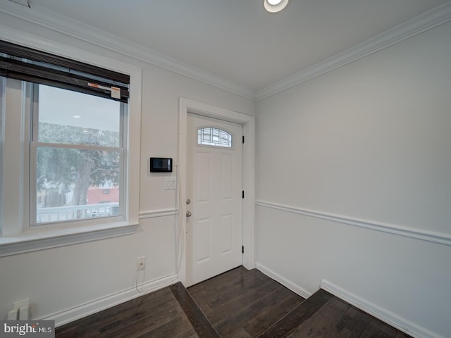 entryway with ornamental molding and dark hardwood / wood-style flooring