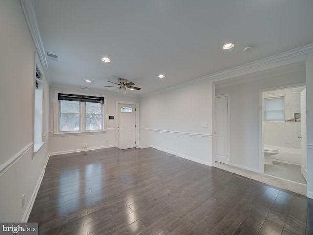 interior space with dark hardwood / wood-style flooring, ornamental molding, and ceiling fan