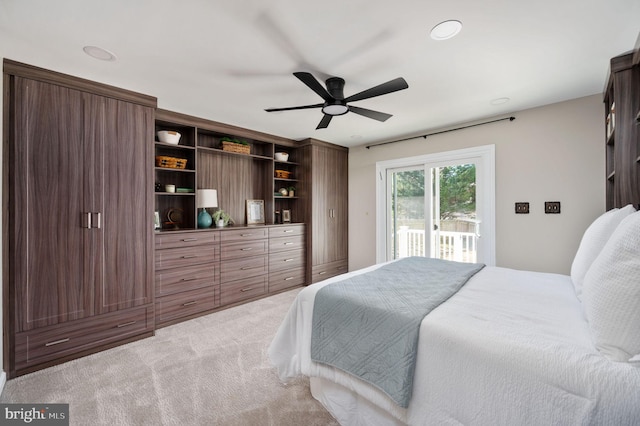 bedroom with access to exterior, ceiling fan, and carpet