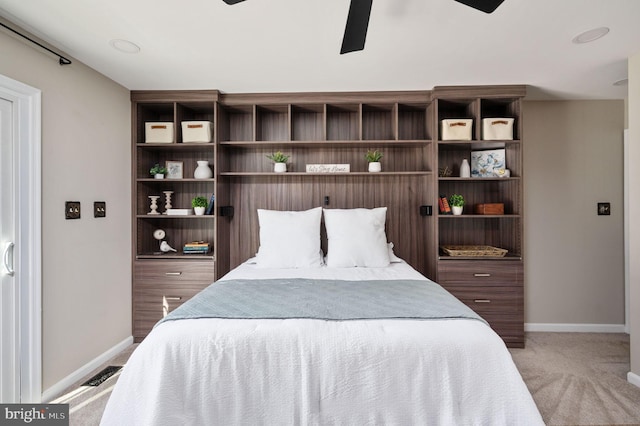 bedroom with light carpet and ceiling fan