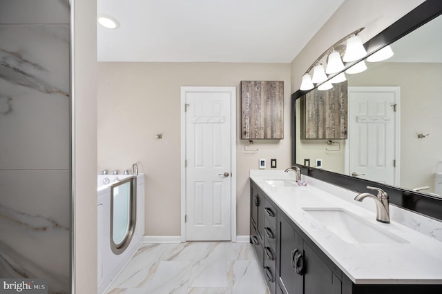 bathroom with vanity and independent washer and dryer