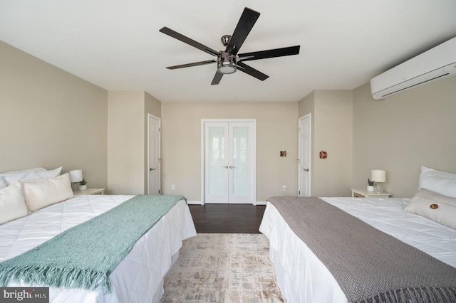 bedroom with french doors, ceiling fan, a wall mounted air conditioner, and hardwood / wood-style flooring