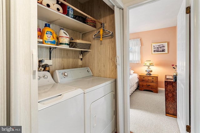 laundry area with carpet flooring and washer and clothes dryer