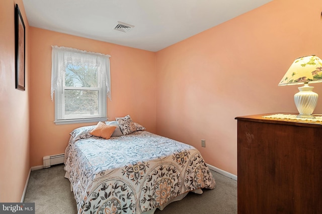 bedroom featuring a baseboard radiator and carpet