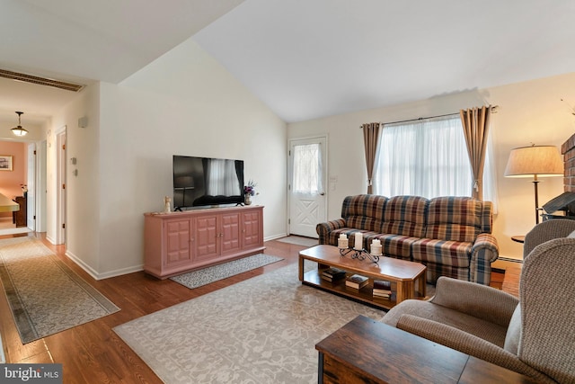 living room with hardwood / wood-style flooring and lofted ceiling