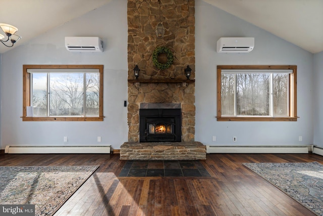 unfurnished living room featuring a baseboard radiator, a stone fireplace, and an AC wall unit