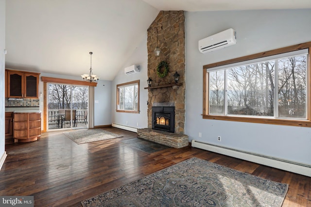 unfurnished living room with an AC wall unit, a baseboard heating unit, and a stone fireplace