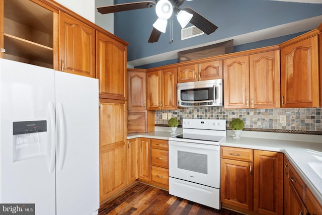 kitchen featuring dark hardwood / wood-style flooring, ceiling fan, backsplash, and white appliances