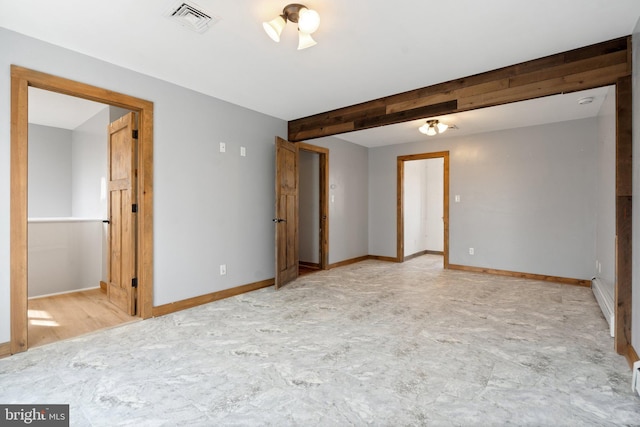 empty room featuring beamed ceiling and a baseboard radiator