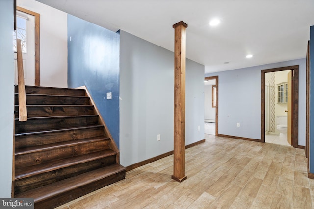 stairway with wood-type flooring