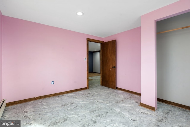 unfurnished bedroom featuring a baseboard radiator