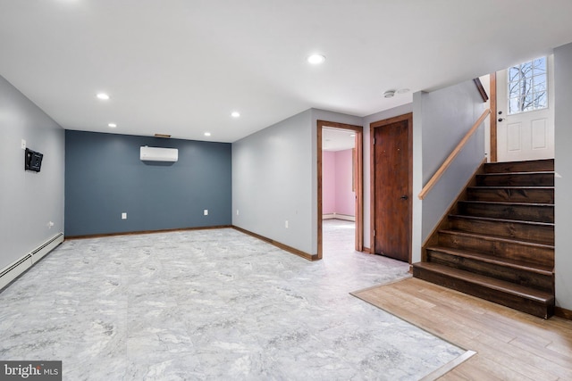 basement with a baseboard heating unit and an AC wall unit