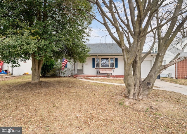 view of front facade with a garage and a porch