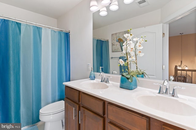 bathroom with vanity and toilet