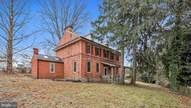 back of house with a yard