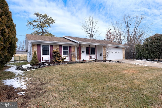 single story home with a garage and a front lawn