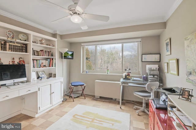 office space featuring a ceiling fan, built in desk, light floors, and ornamental molding