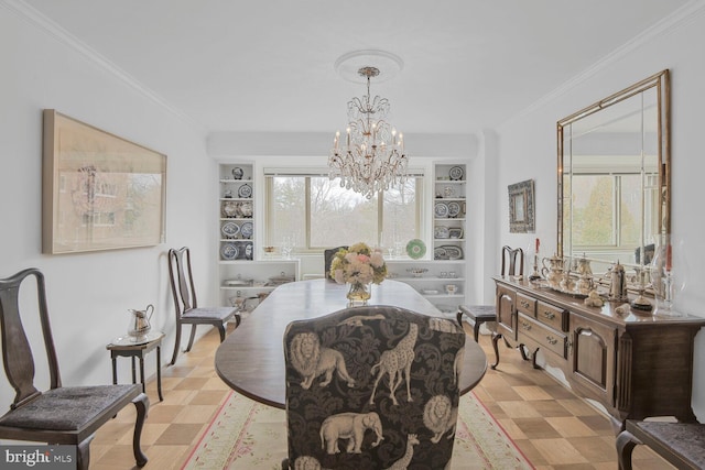 dining area with crown molding, built in features, and light floors