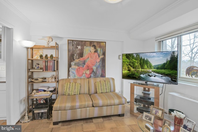 living area with radiator and ornamental molding