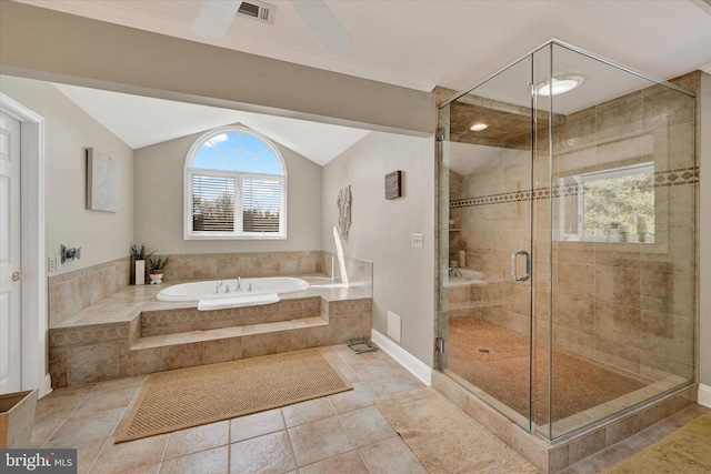 bathroom featuring visible vents, a garden tub, a shower stall, tile patterned flooring, and vaulted ceiling