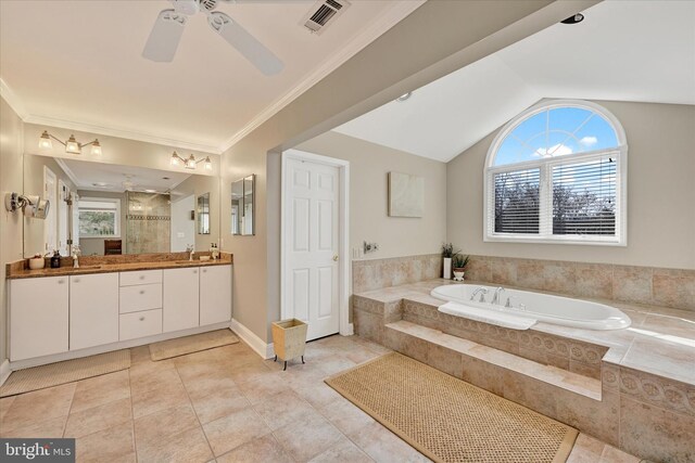 full bathroom featuring visible vents, a garden tub, ornamental molding, tiled shower, and vanity