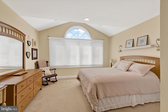 bedroom with light carpet, baseboards, and vaulted ceiling