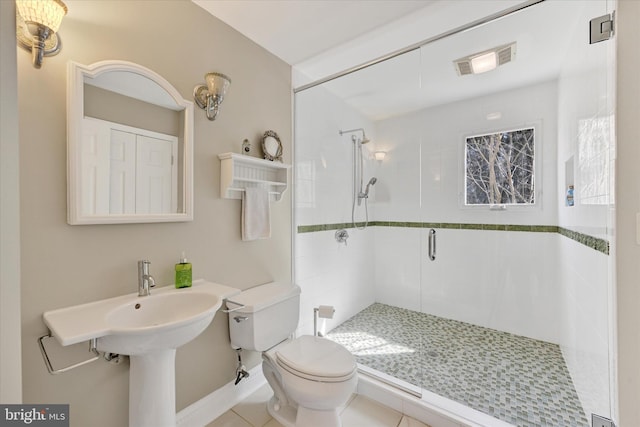 bathroom featuring visible vents, toilet, a shower stall, and tile patterned flooring