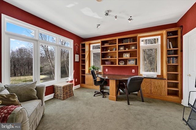 home office featuring carpet flooring and baseboards