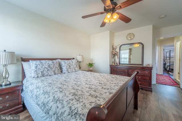 bedroom featuring dark hardwood / wood-style floors and ceiling fan