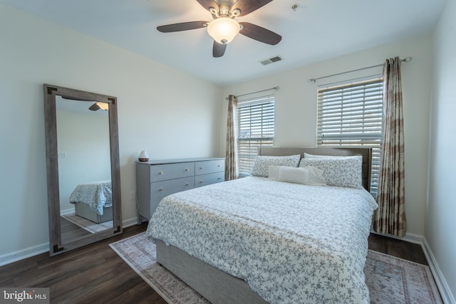 bedroom with dark wood-type flooring and ceiling fan