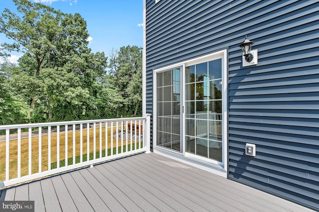 wooden deck with a yard