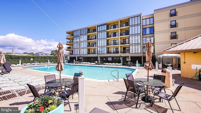 view of swimming pool with a patio