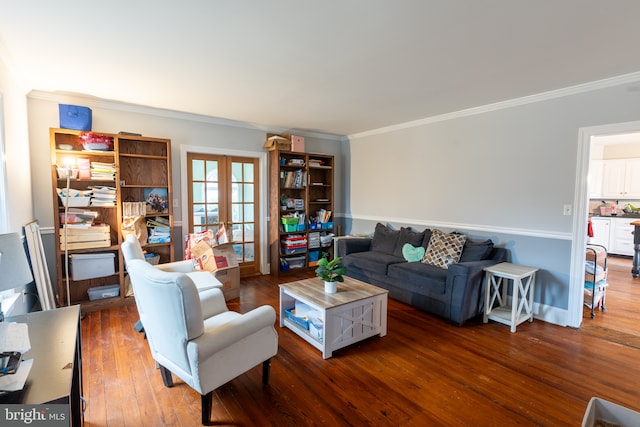 living room with dark hardwood / wood-style floors, ornamental molding, and french doors