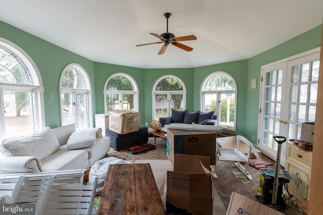 sunroom featuring french doors, ceiling fan, and plenty of natural light