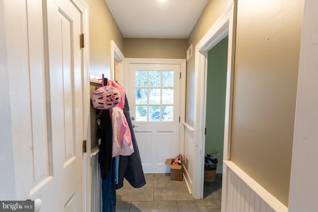 doorway to outside featuring light tile patterned floors