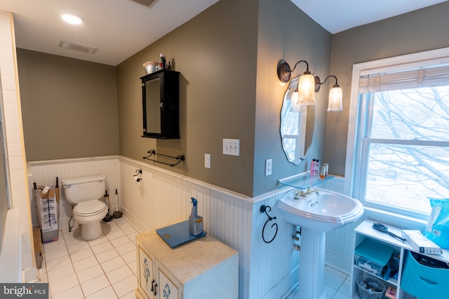 bathroom with tile patterned flooring and toilet