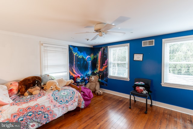 bedroom featuring dark wood-type flooring and ceiling fan