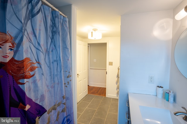 bathroom with tile patterned flooring and sink