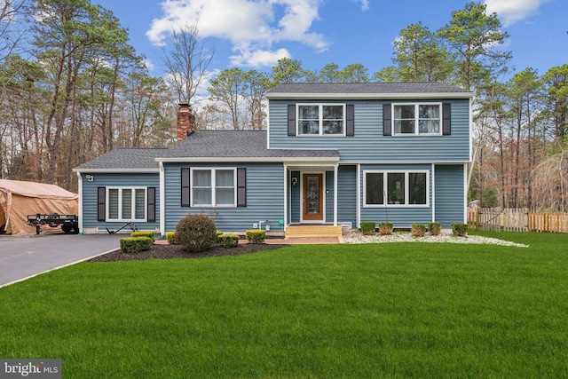 217 Falls Ct, Medford, NJ 08055 - view of front facade featuring a chimney, fence, and a front lawn
