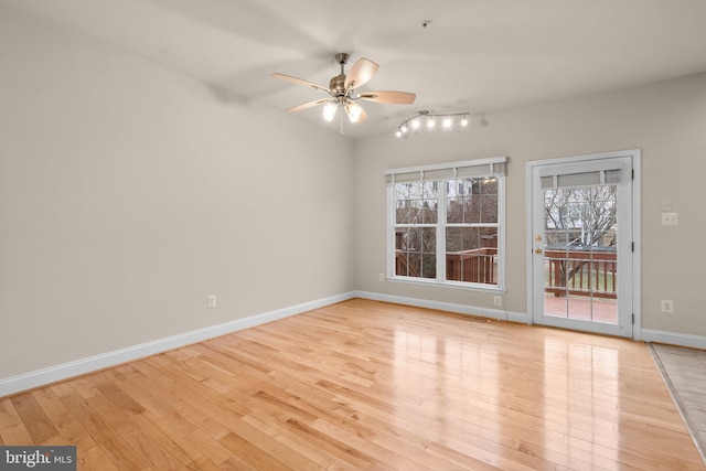 unfurnished room with ceiling fan and light wood-type flooring