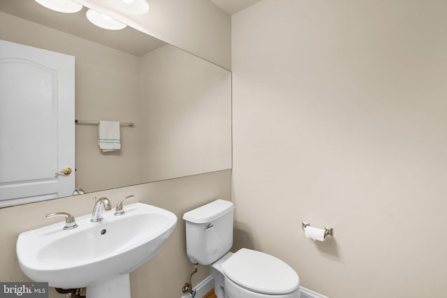 bathroom with toilet and sink