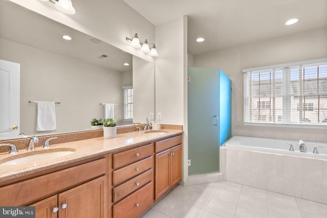 bathroom with vanity, independent shower and bath, and tile patterned flooring