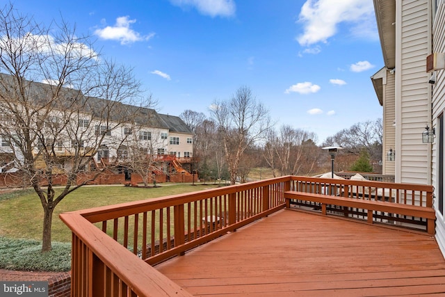 wooden terrace with a yard