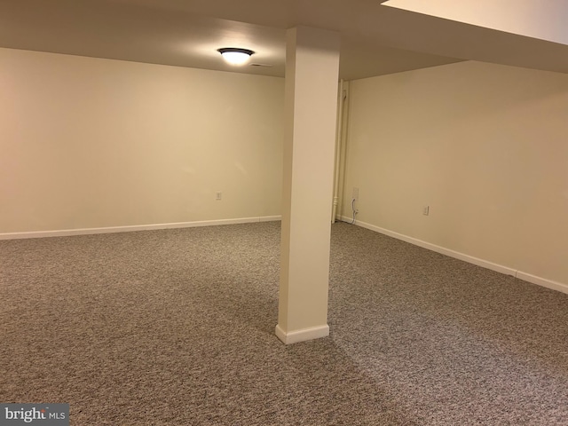 basement with dark carpet