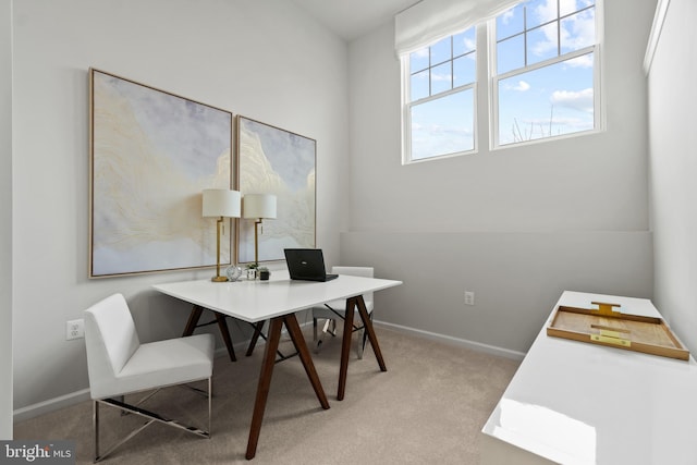 office featuring baseboards and light colored carpet