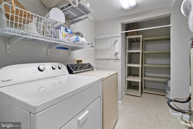 washroom with washing machine and dryer