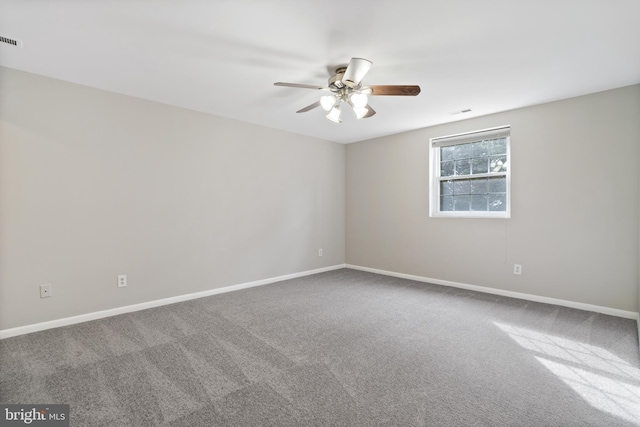 carpeted empty room with ceiling fan