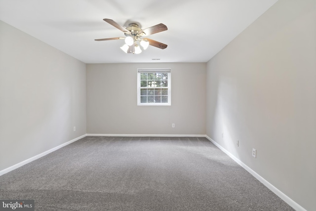 unfurnished room featuring carpet and ceiling fan