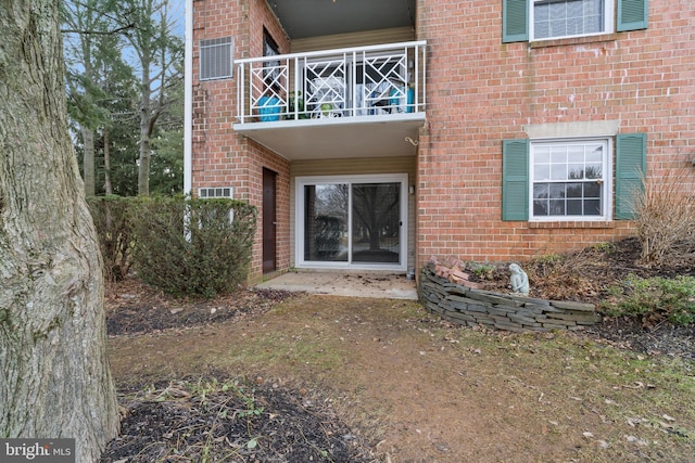 back of property with a balcony